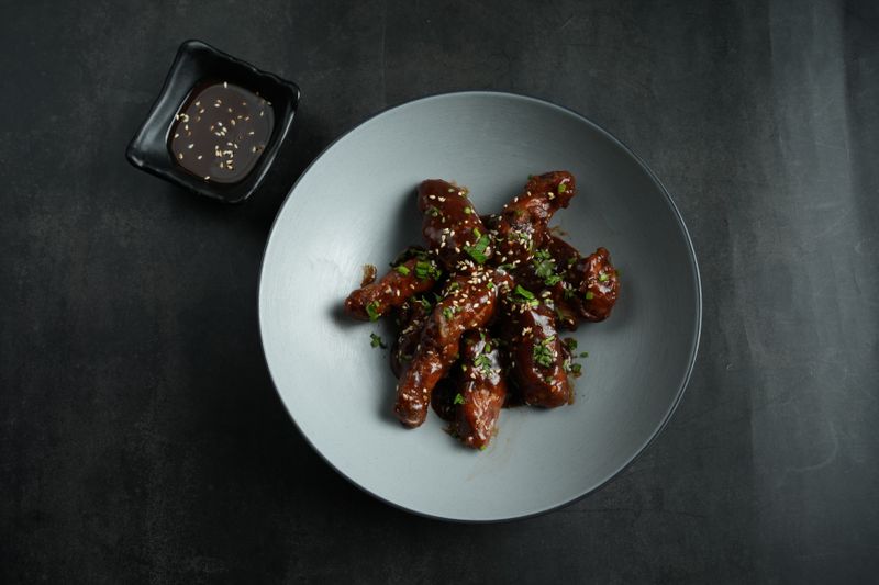 Korean BBQ glazed wings with sesame and scallions